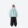 Youth 3-layer ski suit with bib pants - ice blue jacket with black pants, kids on-model back view, for family resort ski days