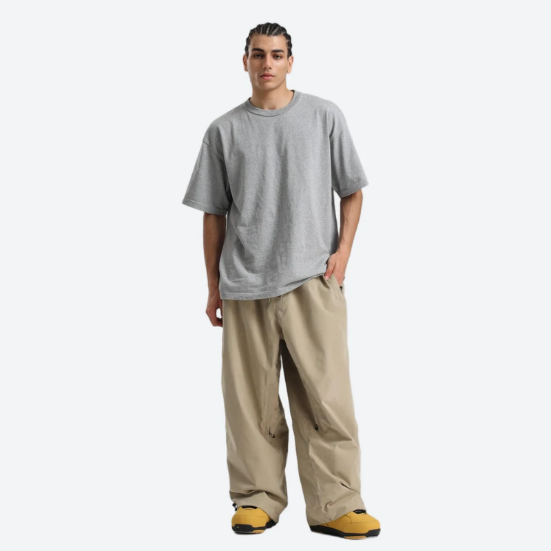Unisex snowboard jacket and pants set - tan snow pants with gray tee, on-model front view, for resort and street wear