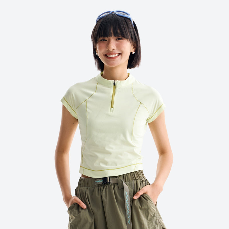 Women's wrinkle-resistant half-zip top - lime cream half-zip short sleeve tee on women with headband