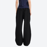 
                  
                    Breathable sun-protection wide-leg trail pants - black wide-leg cargo pants with navy tee, for hiking and trail walking
                  
                