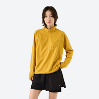
                  
                    Unisex boxfleece half-zip sweatshirt - mustard boxfleece half-zip sweatshirt on women with black shorts, front standing view
                  
                