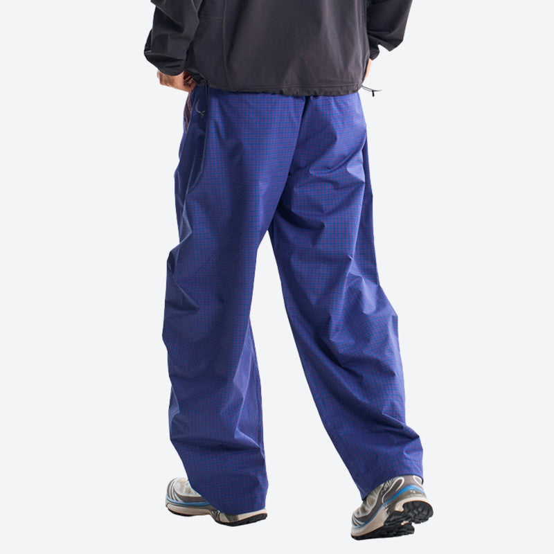 Breathable relaxed trail pants with drawcord waist - blue quick-dry hiking pants with black hoodie, back walking view