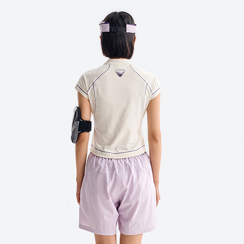 Women's fitted quick-dry breathable tee - cream white half-zip short sleeve tee on women with cap, back view with arm band
