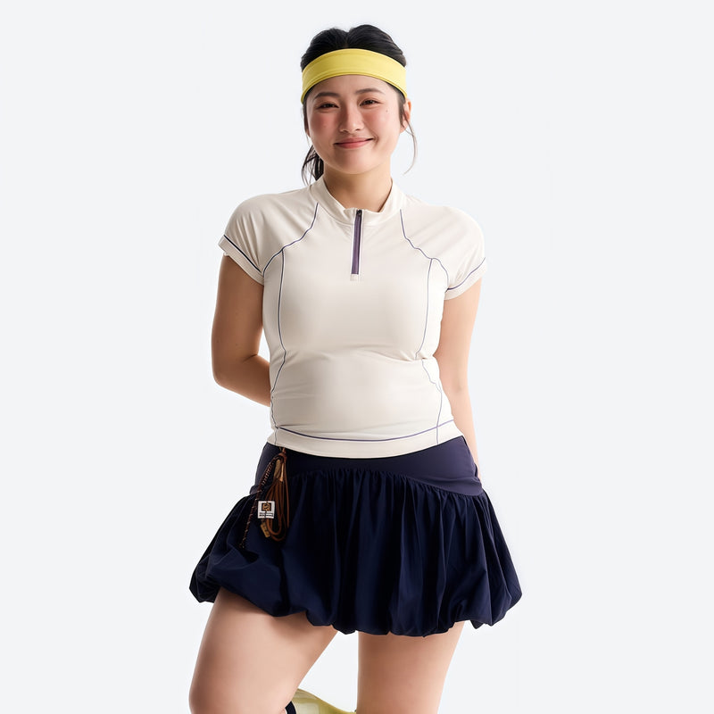 Women's wrinkle-resistant half-zip top - cream white half-zip short sleeve tee on women with cap