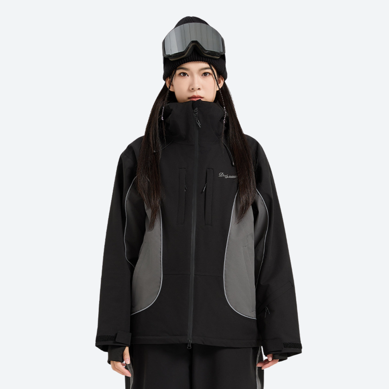 Season end clearance snow wear collection - black gray color-block ski jacket on women with goggles beanie