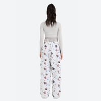 
                  
                    Women's breathable paw print pullover ski jacket - white print pants with gray top, for cold-weather winter sports
                  
                
