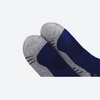 
                  
                    Breathable knee-high merino ski socks with jacquard - navy gray merino ski socks, foot close-up, for cold-weather training
                  
                