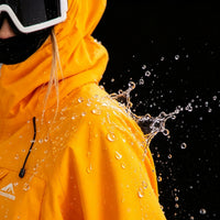 
                  
                    Men's breathable ski jacket and pants set - amber orange, for resort and backcountry days
                  
                