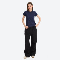 
                  
                    Water-repellent cargo hiking pants with drawcord hem - black wide-leg cargo pants with navy tee, for travel and daily commute
                  
                