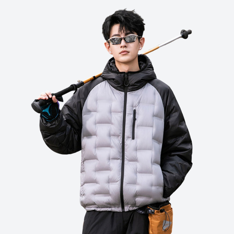 Warm waterproof down jacket with contrast panels - gray black color-block duck down jacket on men with sunglasses