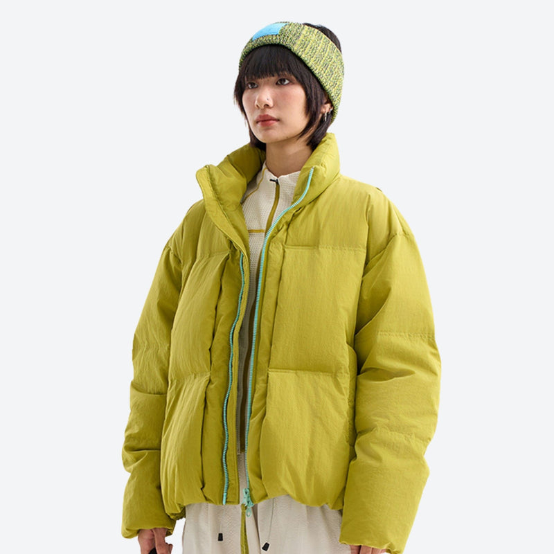 Warm windproof puffer jacket for cold days - lime windproof stand-collar down jacket on women with beanie