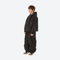 
                  
                    Kids breathable snowboard jacket and bib pants set - black, kids on-model side view, for youth snow play and sledding
                  
                