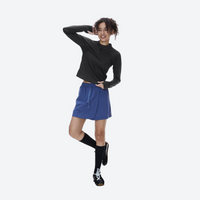 
                  
                    Breathable warm fleece pullover with half zip - black boxfleece half-zip sweatshirt on women, pose view with blue skirt
                  
                