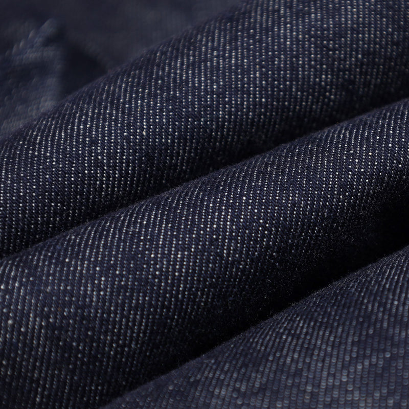 Unisex denim-look bib snow pants - navy denim, fabric texture close-up detail, for cold-weather winter sports