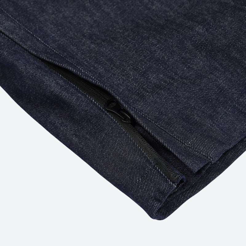 Breathable waterproof jean-style suspender ski pants - navy denim, hem zip close-up detail, for resort and street wear