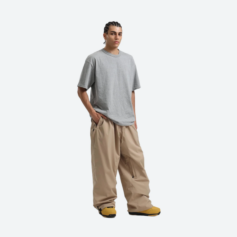 Men's waterproof 2L snow jacket and pants - tan snow pants with gray tee, for powder days and winter commute