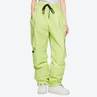 
                  
                    Men's breathable ski jacket with cargo pants - lime green snow pants, on-model front view, for cold-weather winter sports
                  
                