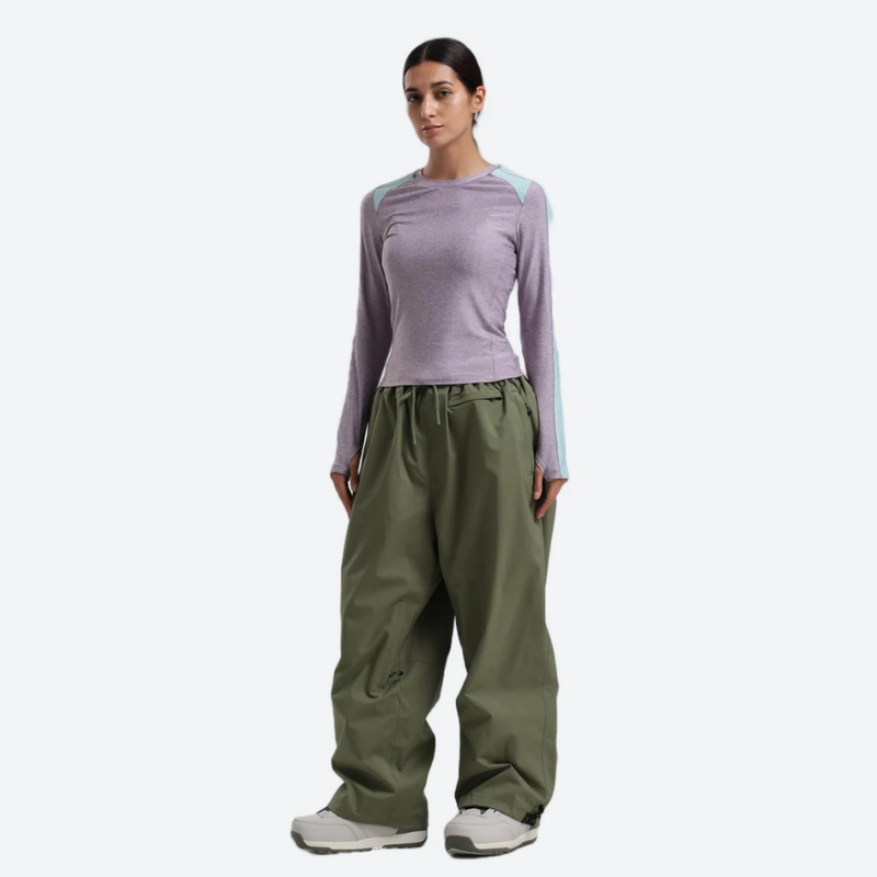 Women's breathable ski jacket with chest zip pockets - olive green snow pants with lavender top, for skiing and snowboarding
