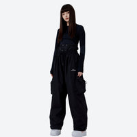 
                  
                    Unisex waterproof 2L asymmetric snow jacket - black snow pants with black top, for skiing and snowboarding
                  
                