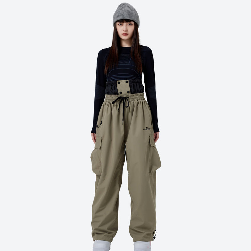 Unisex waterproof 2L asymmetric snow jacket - tan snow pants with black top, for cold-weather winter sports