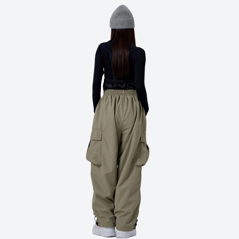 Breathable 2-layer asymmetrical ski jacket with pants - tan snow pants with black top, for cold-weather winter sports