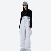
                  
                    Unisex asymmetric snowboard jacket and cargo pants - white snow pants with black top, for skiing and snowboarding
                  
                