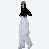 
                  
                    Breathable 2-layer asymmetrical ski jacket with pants - white snow pants with black top, for powder days and winter commute
                  
                