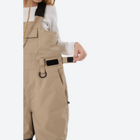 
                  
                    Youth 3-layer ski suit with bib pants - tan bib pants with black knee patches, for cold-weather winter outdoor fun
                  
                