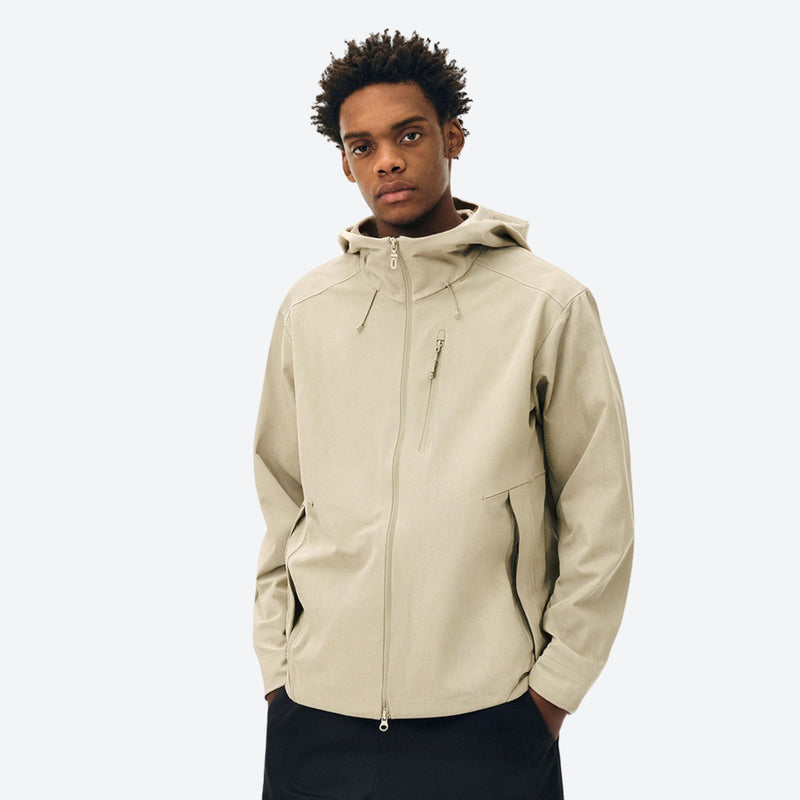 Unisex seamless waterproof softshell jacket - cream softshell jacket, on-model front view, for powder days and winter commute
