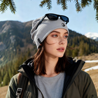 
                  
                    Cocoon 95 percent merino wool beanie ultra soft - light gray merino beanie on women with sunglasses, worn front view
                  
                