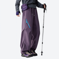 
                  
                    Unisex detachable liner insulated pants for winter - purple down pants with gray top, for resort and backcountry days
                  
                