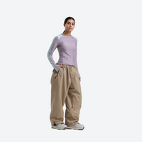 
                  
                    Women's 2-layer snowboard jacket and pants - lavender base layer top with tan snow pants, for skiing and snowboarding
                  
                