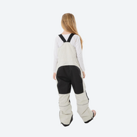 
                  
                    Kids breathable snowboard jacket and bib pants set - cream bib pants with black knee patches, kids on-model back view
                  
                