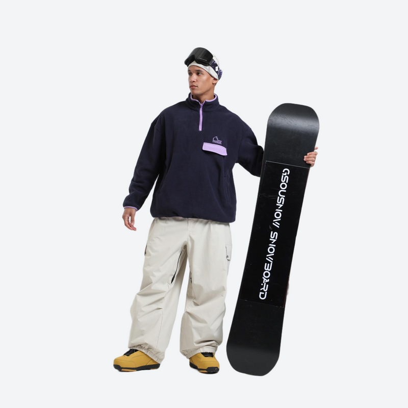 Waterproof 3L cargo snow pants - cream snow pants, on-model front with upright snowboard, for skiing and snowboarding