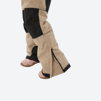 
                  
                    Youth 3-layer ski suit with bib pants - tan bib pants with black knee patches, reinforced knee and seat patches
                  
                