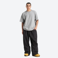 
                  
                    Breathable 3-layer ski pullover with balloon pants - black snow pants with gray tee, for skiing and snowboarding
                  
                