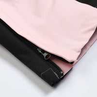 
                  
                    Women's breathable colorblock jumpsuit ski suit - pink, hem zip close-up detail, for powder and piste riding
                  
                