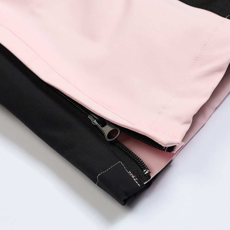 Women's breathable colorblock jumpsuit ski suit - pink, hem zip close-up detail, for powder and piste riding