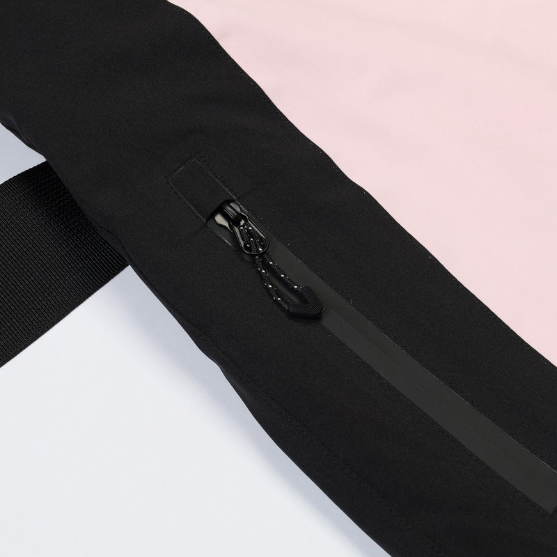 Women's breathable colorblock jumpsuit ski suit - pink, thigh zip vent close-up detail, for cold-weather winter sports