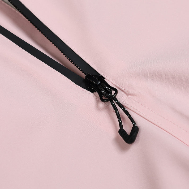 Women's breathable colorblock jumpsuit ski suit - pink, chest zip pull close-up detail, for resort and backcountry days