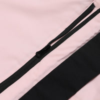 
                  
                    Women's waterproof one-piece snow suit - pink, side seam zip close-up detail, for cold-weather winter sports
                  
                