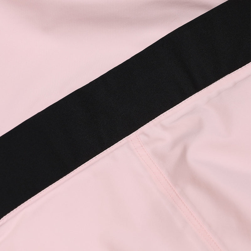 Women's one-piece snowboard suit with waist belt - pink, colorblock panel close-up detail, for resort and backcountry days
