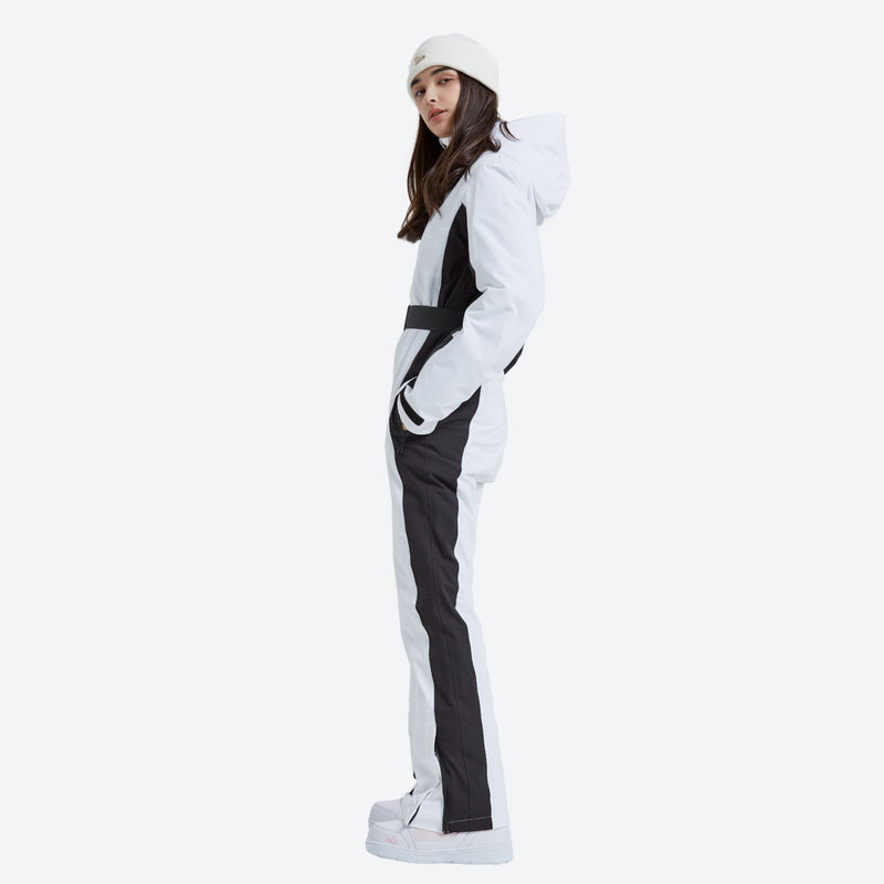 Women's waterproof one-piece snow suit - white black one-piece snow suit, on-model side view, for cold-weather winter sports