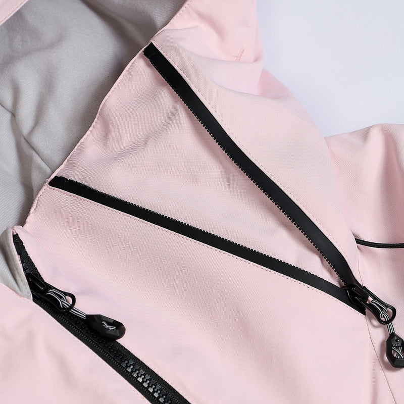 Unisex waterproof one-piece snow suit - pink one-piece suit, chest zip close-up detail, for resort and backcountry days