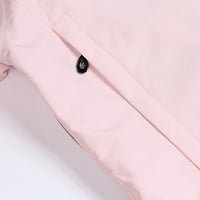 
                  
                    Unisex waterproof one-piece snow suit - pink one-piece suit, pocket snap close-up detail, waterproof breathable shell fabric
                  
                