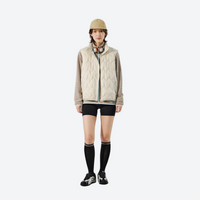 
                  
                    Unisex ultralight packable down vest and jacket - cream white ultralight down vest on women with beanie
                  
                