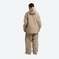 
                  
                    Women's 2-layer snowboard jacket and pants - tan jacket with tan pants, on-model back hood view, for resort and street wear
                  
                