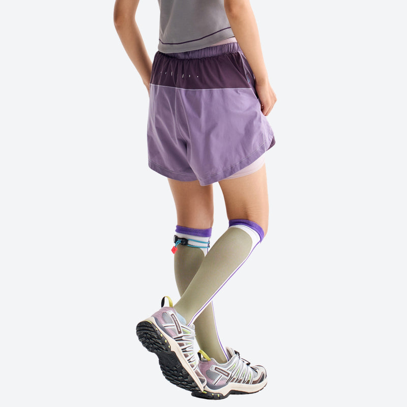 Women's lightweight running shorts with liner - purple quick-dry shorts with built-in yoga liner, back walking view
