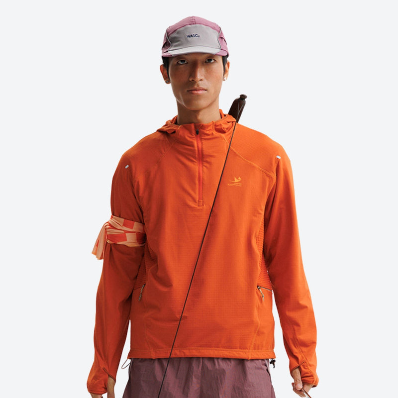 Breathable half-zip mid-layer with recycled fabric - orange quick-dry lightweight half-zip mid-layer on men with cap