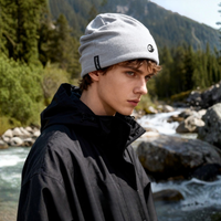 
                  
                    Fine 17.5 micron merino wool beanie - light gray merino beanie on men, worn side view, for daily commute and office
                  
                